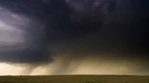 Dramatic Storm with Lightning over Green Field