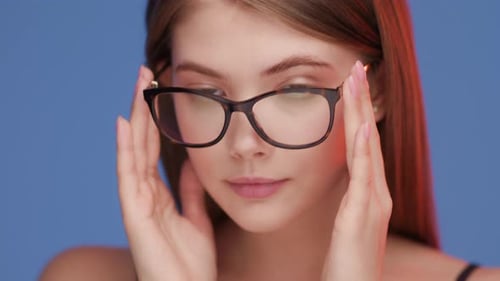 Confident Woman in Glasses Studio Portrait