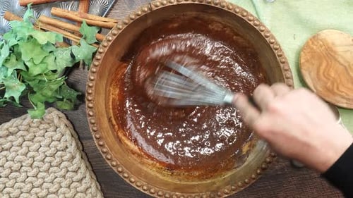 Mixing a Recipe in a Bronze Bowl