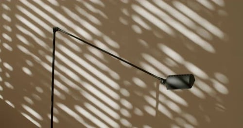 Elegant Floor Lamp Casting Shadows in Sunlight A Modern Home Interior Design