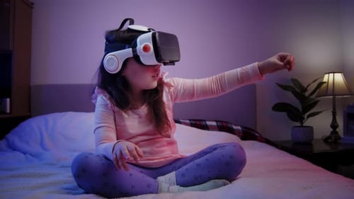Girl Experiencing Virtual Reality in Bedroom at Night