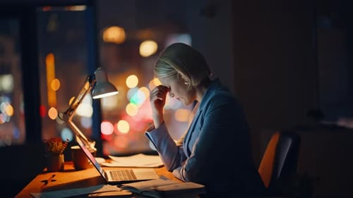 Worker Thinking Business Ideas Texting Computer in Evening Office Tired Blonde