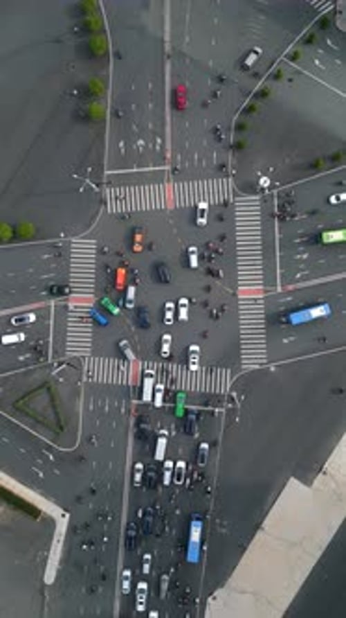 Topdown Aerial View of Busy City Intersection with Motorbikes Ho Chi Minh City