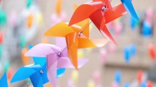 Colorful Pinwheels Spinning Gently in a Breeze
