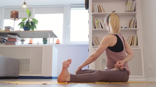 Beautiful Young Woman Doing Yoga at Home Asanas on Yoga Mat Vintage Tonned Close Up Shot Video Slow