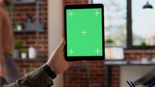 Tablet with Green Screen in Office Environment