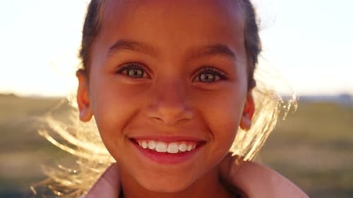 Face, child and smile outdoor with summer holiday, travel adventure and trip for childhood memories