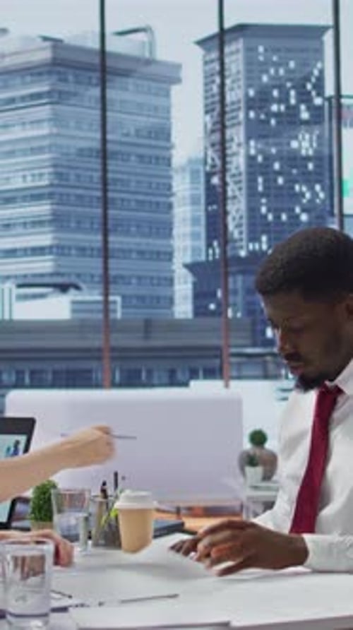 Vertical Video Male Job Candidate Filling in His Application Form in High End Office