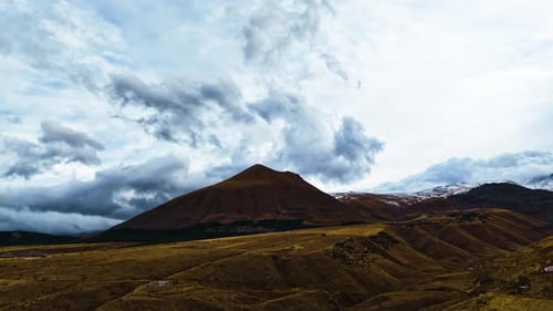 Aerial Shot of Clouds Passing Over Mountains as Winter Begins
