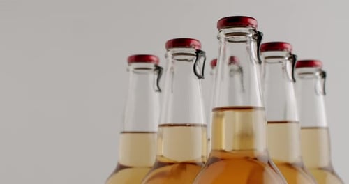 Close Up of Bottles with Amber Liquid