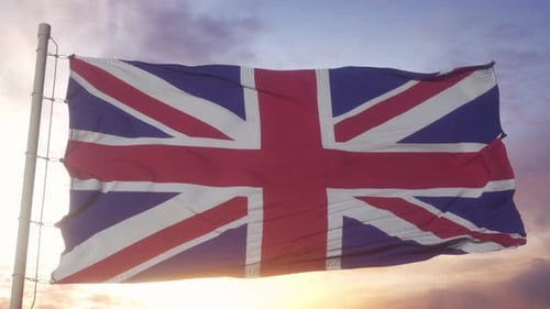 United Kingdom Flag Waving Against Beautiful Sunset Sky