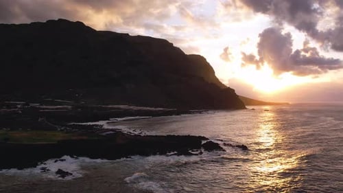 Aerial Sunset Light Over Ocean and Volcanic Cliffs of Tenerife Canary Island