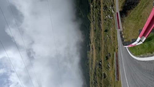 Cinematic view of driving a car on a serpentine road in the mountains.