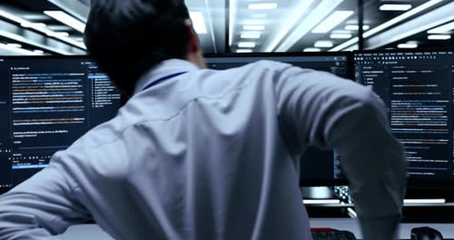 Close Up Of Male Programmer Having A Backache While Writing Code By Desktops In The Server Room