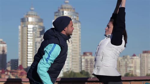 Young Couple Exercising Together in an Urban Setting