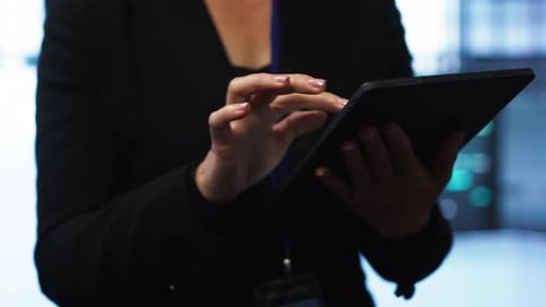 Programmer Managing Data Center Using Digital Device Close Up