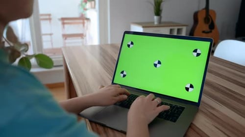 Woman Typing on Laptop with Chroma Key Green Screen