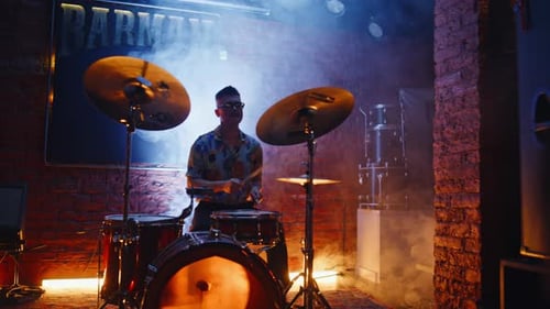 Man Drummer Performing Rock Music on Stage with Musical Band Gorgeous Woman