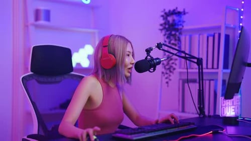 Enthusiastic Young Woman Gaming at Home at Night