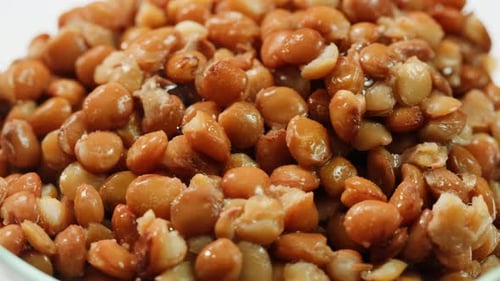 Lentils Macro Open Metal Can with Preserved Steamed Brown Lentils Close Up Isolated on White
