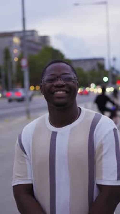 Smiling Man Standing on City Street Sidewalk Portrait