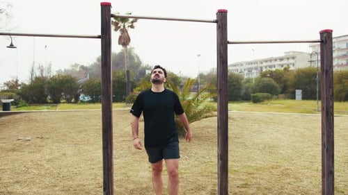 Man Training Doing Pull Ups At The Park Gym