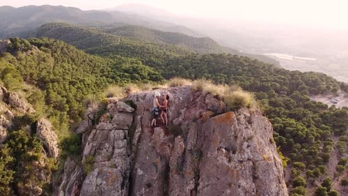 Climbing couple in the mountain. Drone view of climber sportsmen.Physical activity in the countrysid
