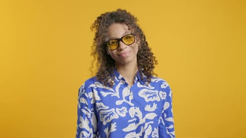 Stylish Woman Smiling in Blue Shirt and Glasses