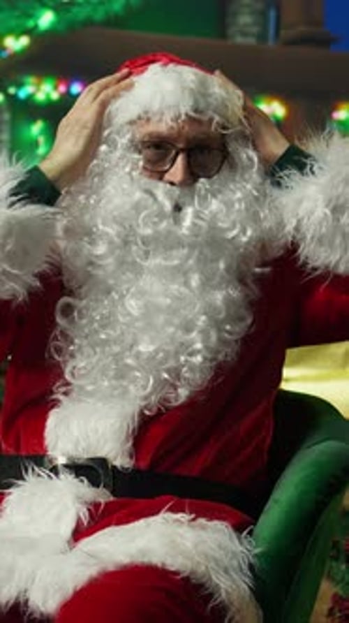 Vertical Video Portrait of Entertainer Dressed As Santa Claus Wearing Fake Beard