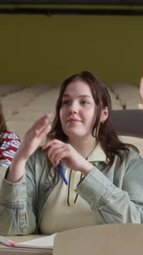 Gen Z Girl Giving Answer during Seminar with Peers in University