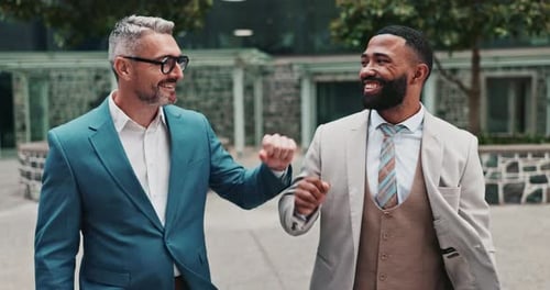 Businessman, fist bump and corporate professionals together, teamwork or celebrating achievement