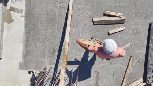 Aerial View Skilled Workers on a Construction Site Pushing the Project Forward
