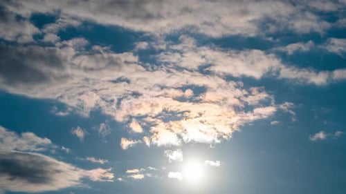 Clouds Moving Across a Blue Sky Time-Lapse