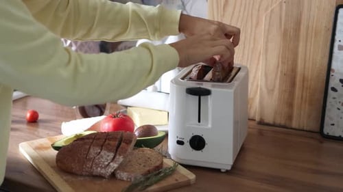 Preparing Sliced Bread with Toaster at Home