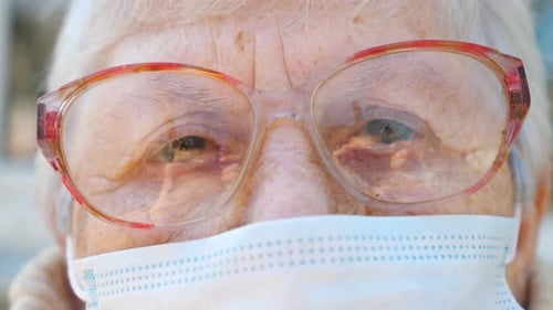 Close Up Face of Granny in Protective Mask From Virus