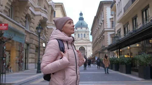 Woman By Gothic Exterior of Old Place