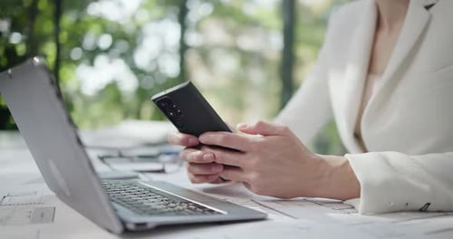 Professional Works On Phone And Laptop With Plans