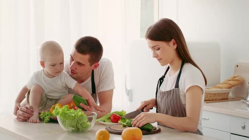 Family Preparing Healthy Meal Together in Bright Kitchen with Toddler