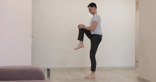 Young Adult Male Doing Leg Exercise at Home
