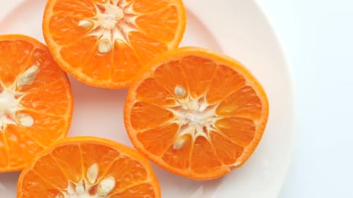 Close Up of Slice of Orange Fruit on Wooden Background
