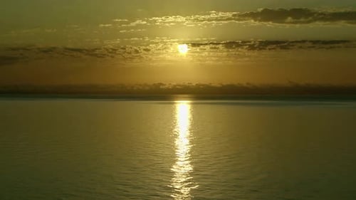 The Endless Horizon Line In The Cloudy Ocean At Shiny Sunrise