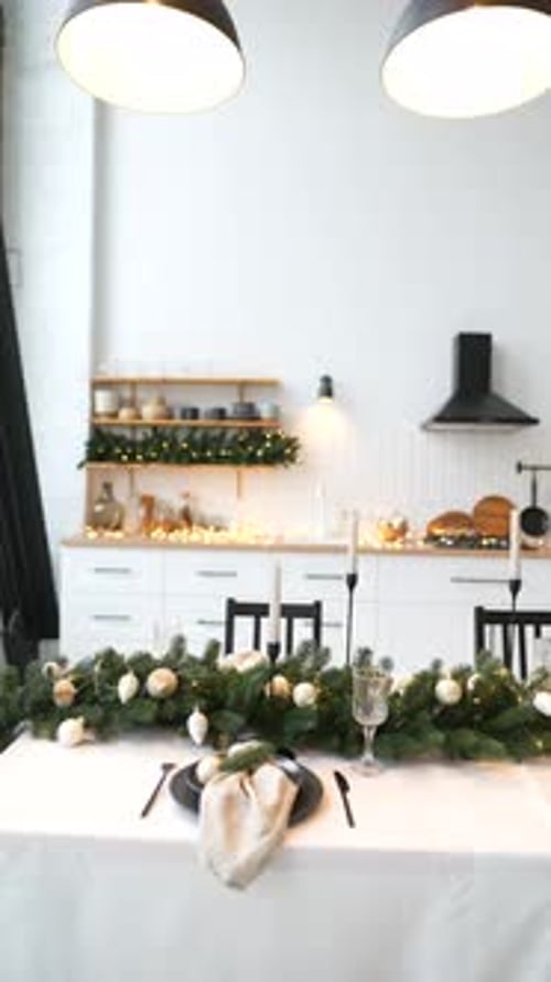 Christmas table setting with garland in a home