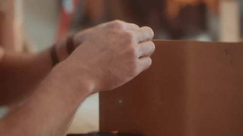 Slow motion of hands stitching leather close up