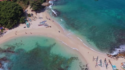 Cinematic drone pan around the iconic Blue Beach in Hiriketiya Sri Lanka