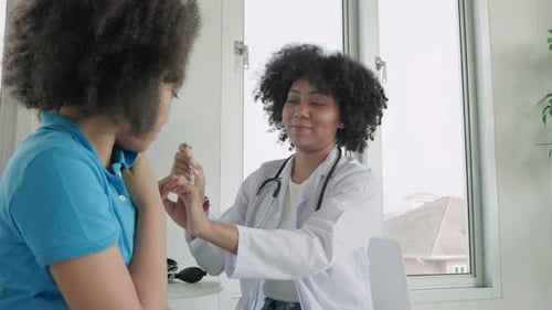 Doctor Examines Child Patient in Medical Office