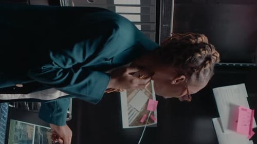 Vertical Video Detective Partners Analyzing Criminal Records in Office