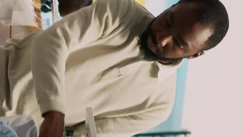 Man choosing shirt in wardrobe at home