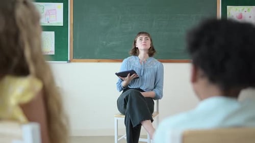 Teacher and students, Learn and study in a classroom of school where youngsters sit and listen