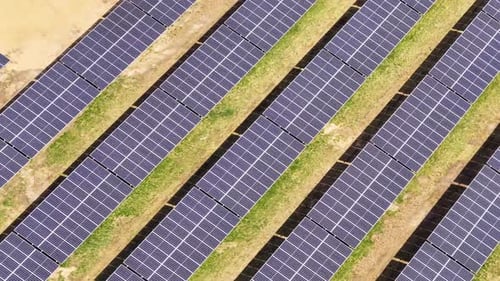 Energy production from solar panels in a vast field during daytime hours