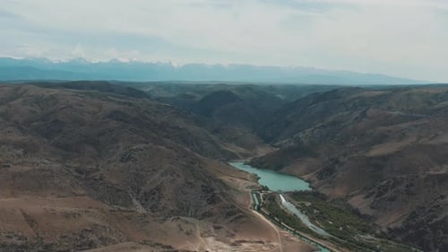 Scenic Aerial View of Rugged Mountains and Reservoir